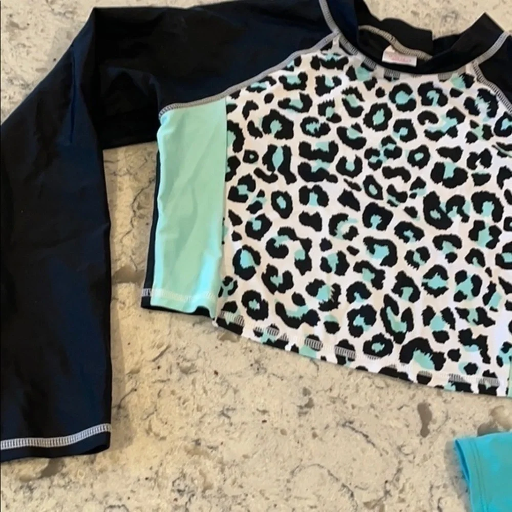 Lands end tops 12-14 bundle shorts and 2. Swim shirts